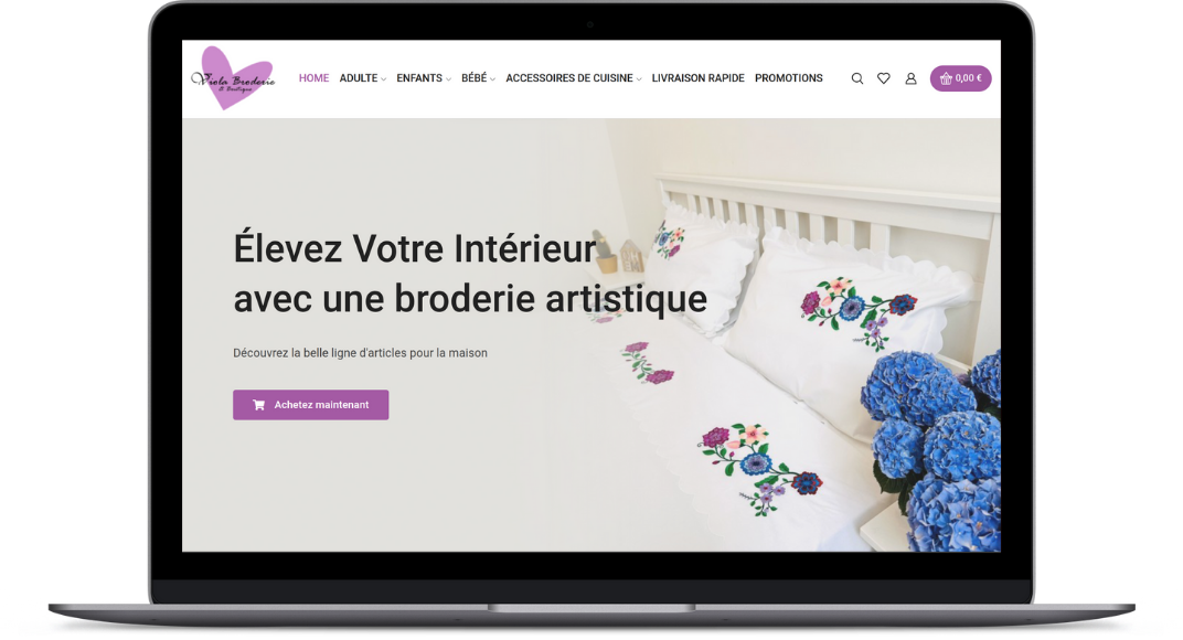 Laptop που εμφανίζει την αρχική σελίδα της Broderie Viola